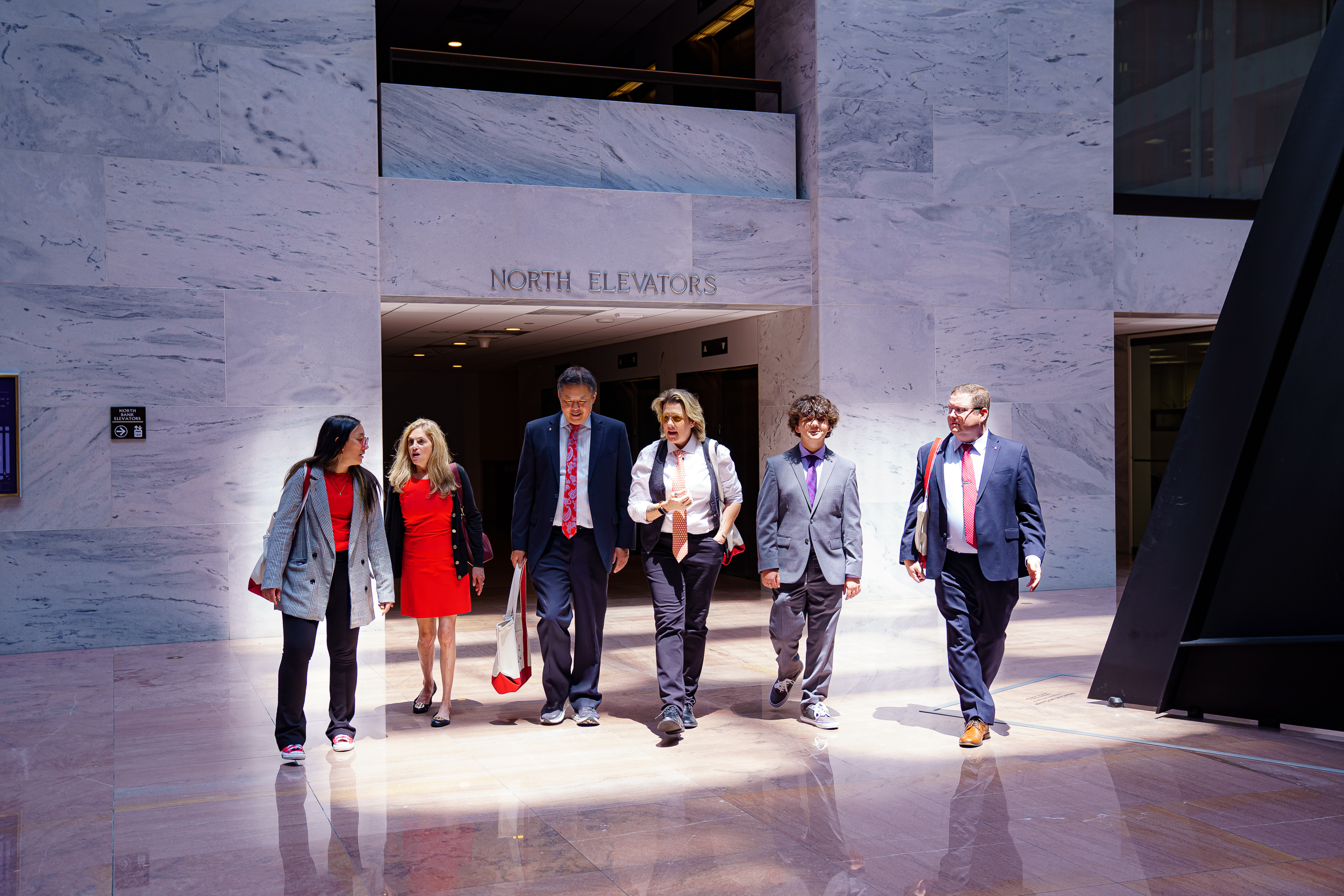Volunteer advocates walking in Congressional building
