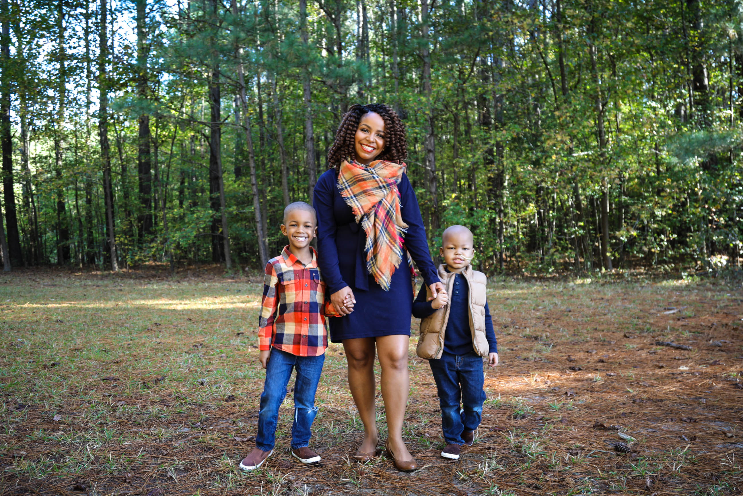 Christian (left), Courtney (center) and Cayden pose for a family phot. 