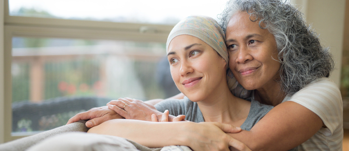 Caregiver hugging patient