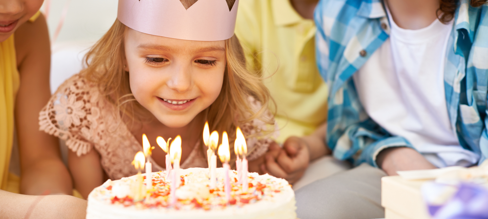 Birthday girl blowing out candles