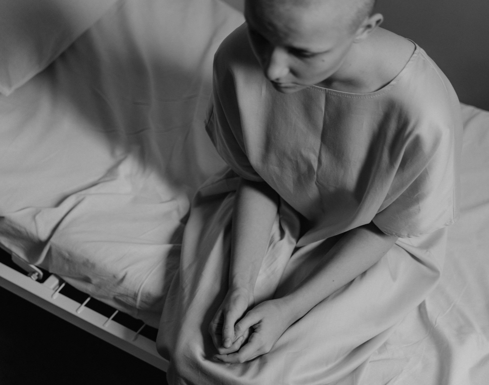 Image of cancer patient on a hospital bed