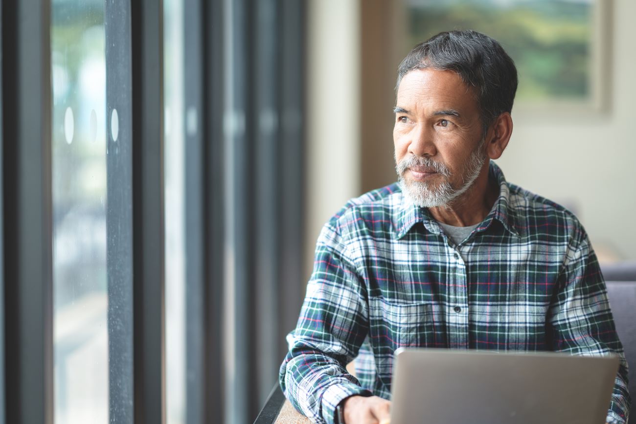 Man watching webcast on laptop