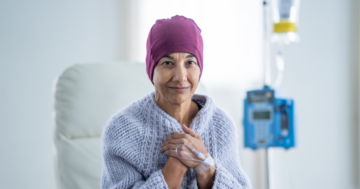 Female patient looking hopeful with IV bag