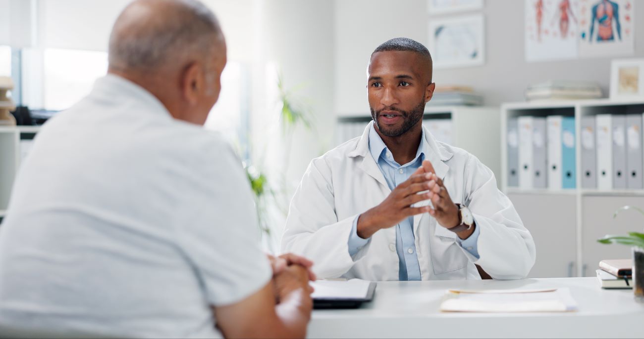 Doctor speaking with male patient