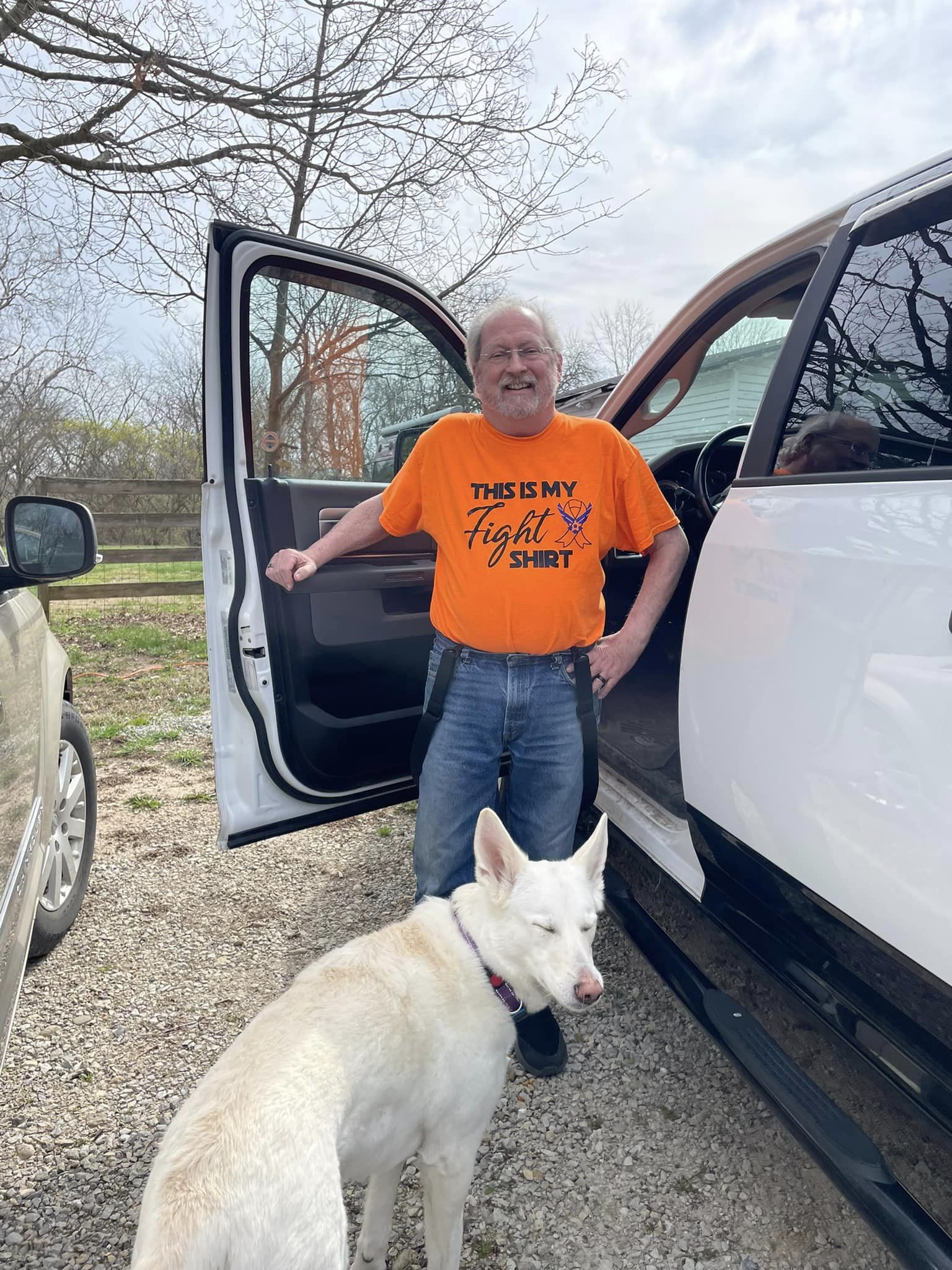 AML, man, glasses, beard, orange shirt, dog