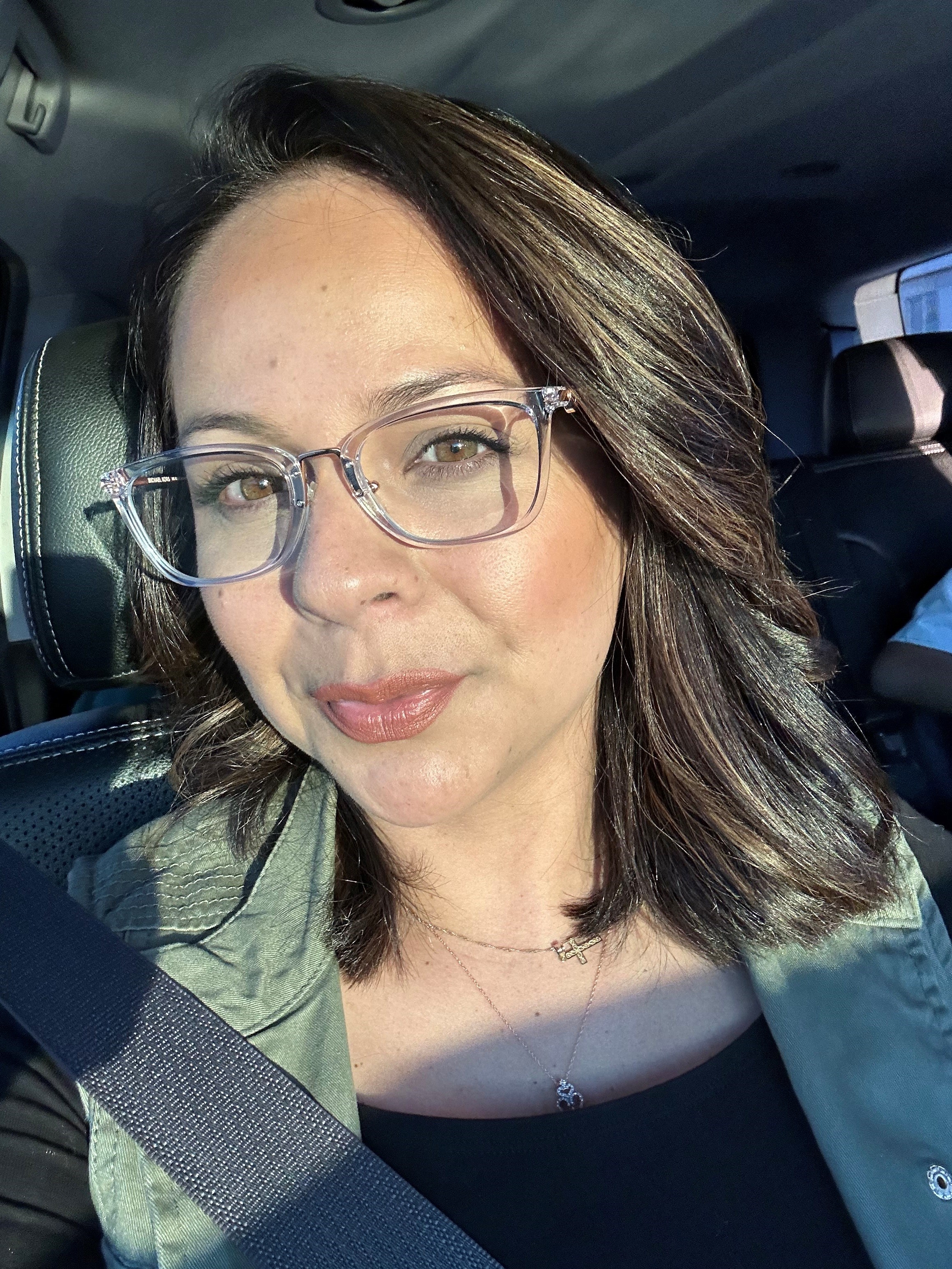 young, hispanic woman with glasses