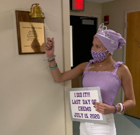 young cuban girl in purple ringing bell