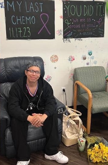 young blood cancer patient sitting in chair