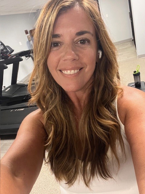 Young woman, long brown hair, white tank top Hodgkin lymphoma (HL)