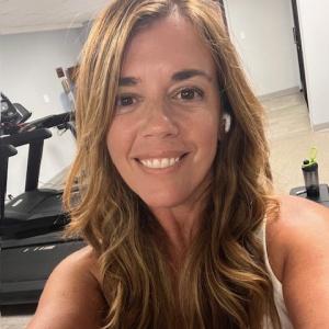 Young woman, long brown hair, white tank top Hodgkin lymphoma (HL)