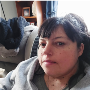 non-Hodgkin lymphoma (NHL) in living space with grey hoodie