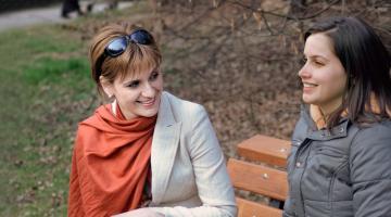 two woman on park bench