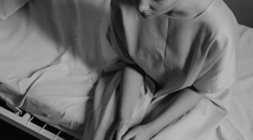 Image of cancer patient on a hospital bed