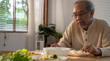 Man eating at table