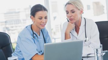 Doctor and nurse on laptop