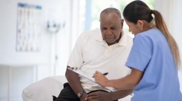 Nurse speaking to patient