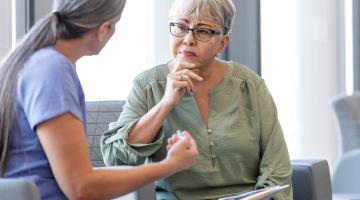 Doctor and elderly female patient speaking