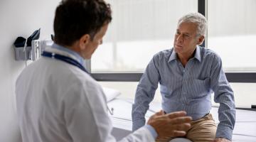 HCP speaking with patient in exam room