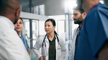 Healthcare professionals speaking in hallway