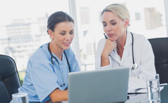 Doctor and nurse on laptop