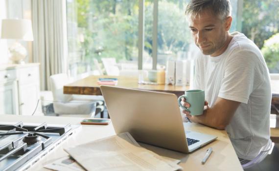 man watching webcast on laptop