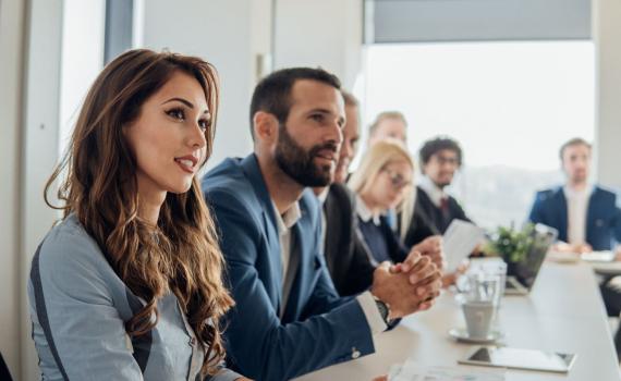 Healthcare professionals having a discussion at a table