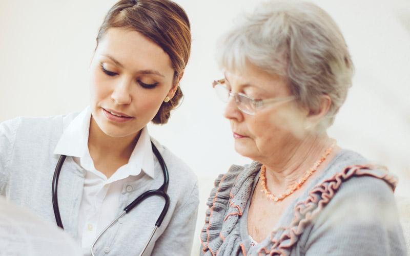Image of Caregiver speaking with a patient