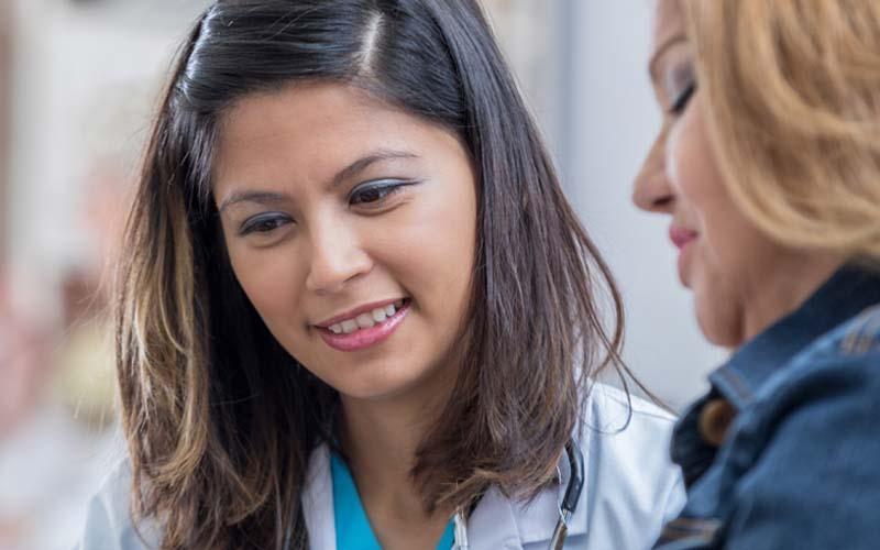 Image of Caregiver speaking with a patient