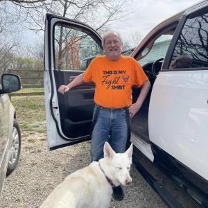 AML, man, glasses, beard, orange shirt, dog