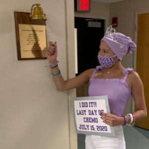young cuban girl in purple ringing bell