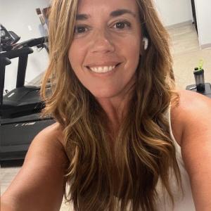 Young woman, long brown hair, white tank top Hodgkin lymphoma (HL)