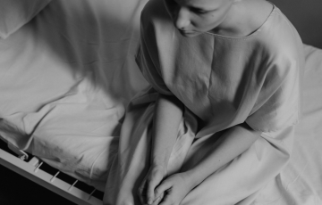 Image of cancer patient on a hospital bed