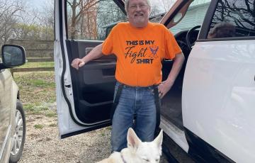 AML, man, glasses, beard, orange shirt, dog