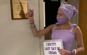 young cuban girl in purple ringing bell