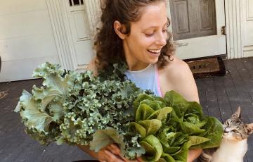 non-Hodgkin lymphoma survivor with green plant and cute cat